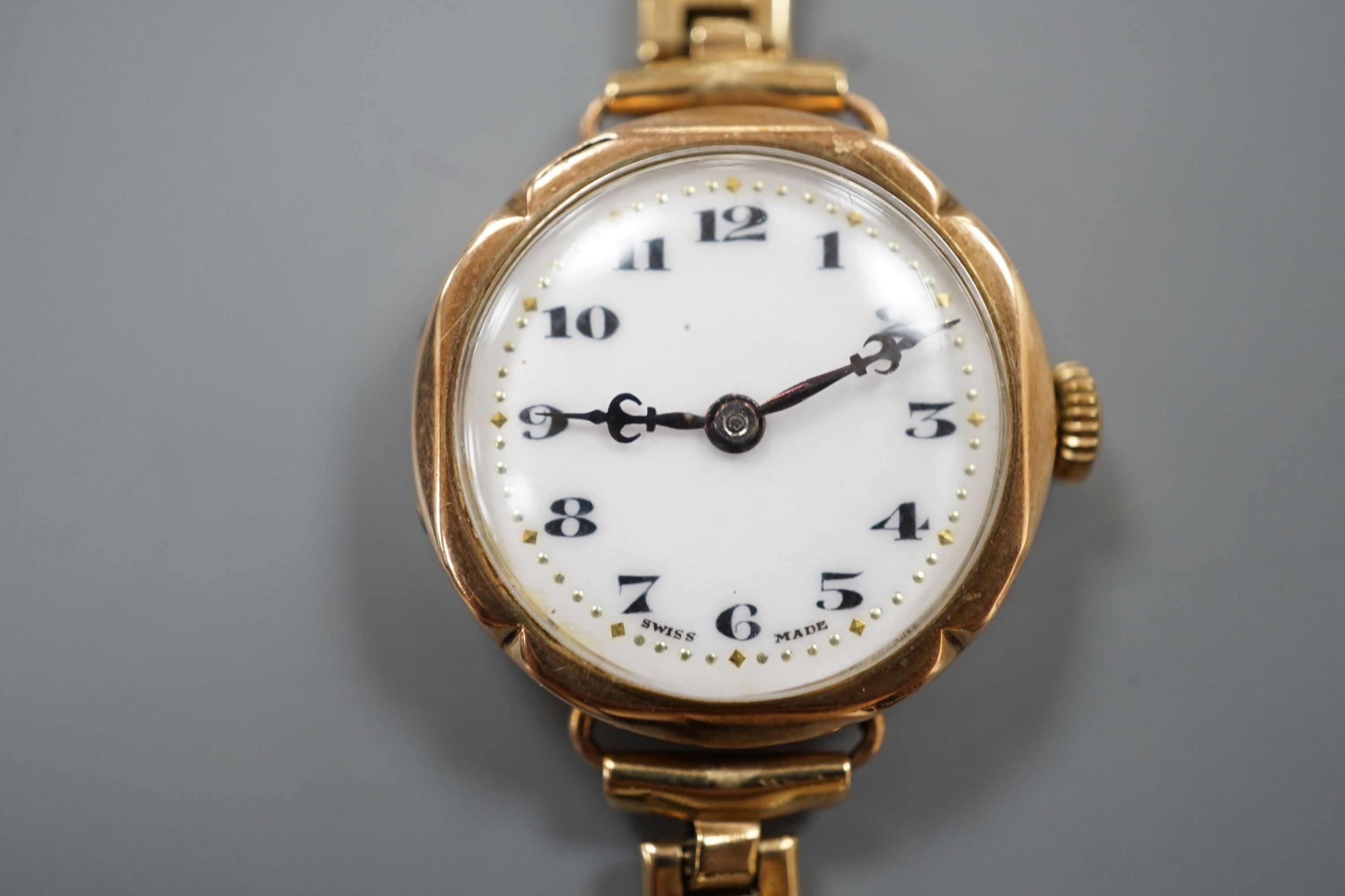 A lady's early 20th century 9ct gold Rolex manual wind wrist watch, on an associated 9ct gold bracelet